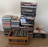 Overall view of multiple CD and DVD stacks and wooden CD crate
