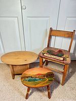 Full view of child chair, painted round stool, and storage stool together
