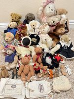 Group shot of all teddy bears, certificates and pouches
