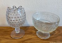 Both glass pieces side by side on wood surface