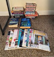 Group shot of all books and magazines on carpet