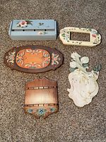 Group shot of all five painted wooden pieces