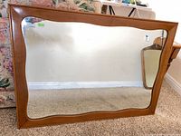 Front view showing full mirror with wood frame