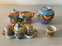 Group shot showing all eight lusterware pieces