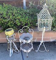 Group shot of birdcage on stand and both plant stands with planter