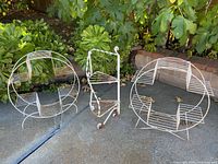 All three metal plant stands grouped together