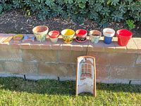 Full lot showing all planters, angel pieces and roof-tile artwork
