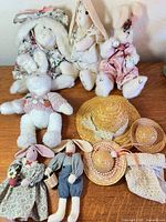 Group shot of all six rabbits, three straw hats, crocheted shawl