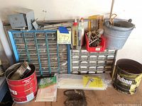 Overall lot with two parts cabinets, pail, cans, adhesives and zip ties