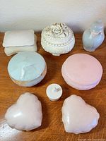 All eight ceramic boxes on tabletop