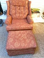 Wingback chair and ottoman showing upholstery and overall style