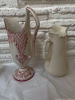 Both ceramic pitchers side by side
