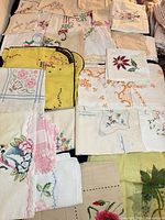Group image of assorted embroidered linens spread out
