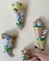 Group shot of all four ceramic wall pockets