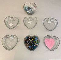 All seven heart bowls with marbles displayed