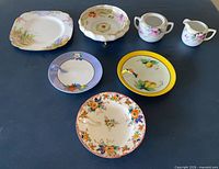 All seven ceramic pieces laid out