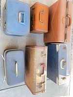 All six pieces arranged to show fronts, handles, relative sizes and wear