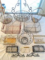 All thirteen baskets and racks arranged together on table