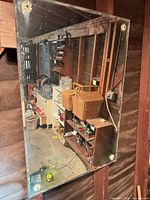 Full view of frameless mirror mounted on wooden wall studs