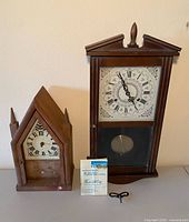 Both clocks side by side showing overall appearance and size comparison
