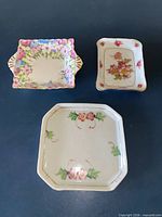 All three porcelain trinket dishes grouped