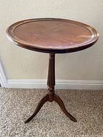 Full view of table showing top, pedestal, and legs