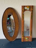 Front view showing both oval and rectangular mirrors together