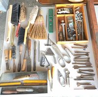 Overhead view of entire lot showing levels, chisels, brushes, trays, drill bits, snips and small hardware