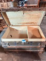 Trunk opened showing interior and tray