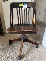 Front view of wooden rolling office chair