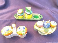 All three ceramic serving sets displayed together