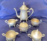 Full set showing coffee pot and five matching pieces