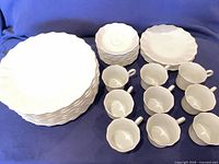 Full set showing stacked plates, saucers and cups
