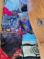 Drawer with multiple patterned scarves and packaged item