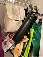 Canvas clothespin holder pouch with clothespins, adjacent fabric totes