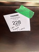 Lot sticker on brown wooden surface