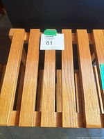 Top view close-up of slatted wooden shelf surface