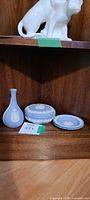Overview of all three Wedgwood blue jasperware pieces on shelf