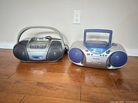 Front view of both Panasonic boomboxes showing model RX-D13 left and RX-D29 right