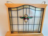 Full frontal view of stained glass panel in frame