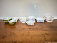 Group view of all eight pieces lined up on floor