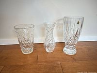 Three cut lead crystal vases front view