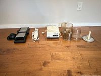 Group shot- Cuisinart processor base, bowls, lids, OXO mandoline, Hamilton Beach carving knife and fork