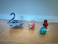 All four glass bird figurines group front view