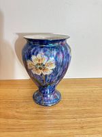 Full view of vase front showing floral motif and lustre glaze