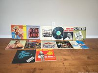 Front view showing all 13 vinyl record covers laid out