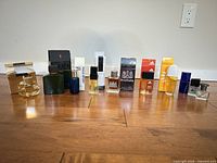 Group shot of all ten fragrance bottles with boxes