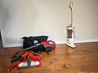 Overall view of both vacuums and accessories