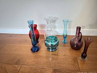 All seven handblown glass pieces grouped on floor