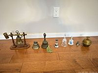Full lineup of nine bells on floor
